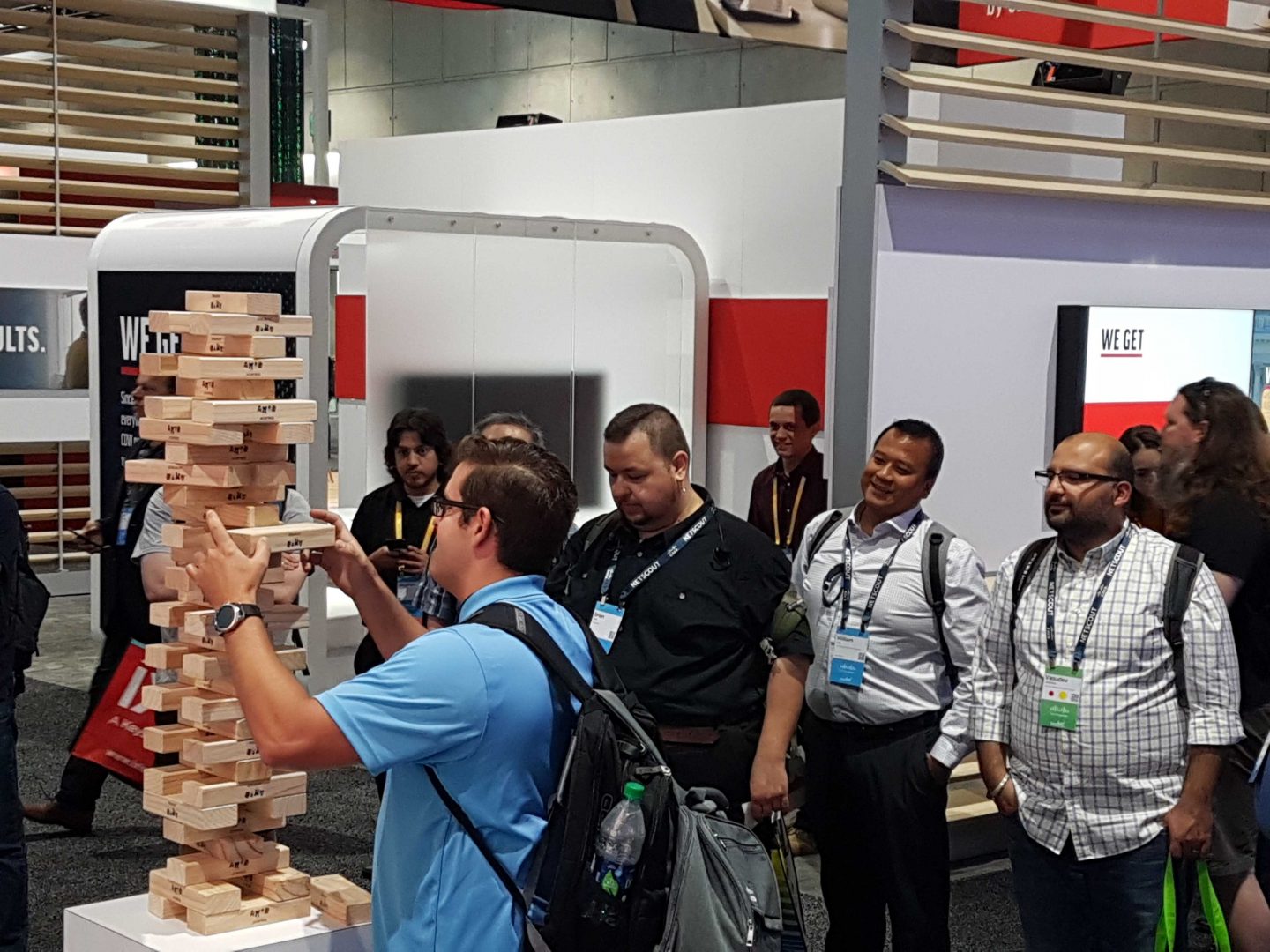 Cisco Live 2019 attendees try out a giant game of Jenga at BlueCat