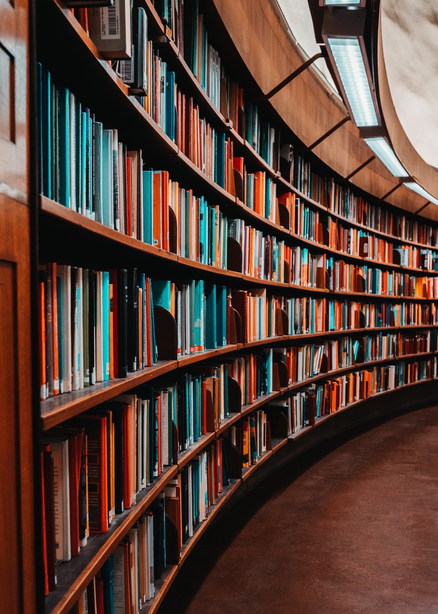 Curved library bookshelves symbolizing deep technical knowledge and uncovering myths around Active Directory and DNS
