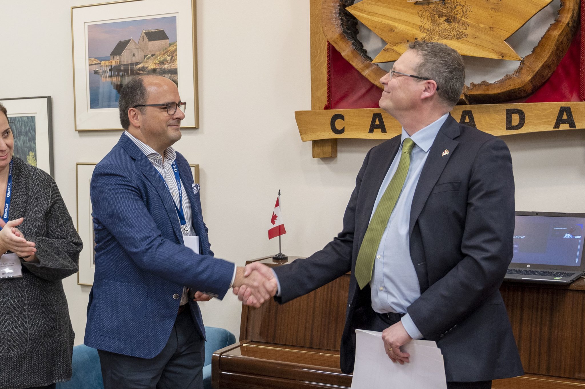 CEO Stephen Devito shakes hands with Giles Norman, Ambassador of Canada to Serbia, during BlueCat