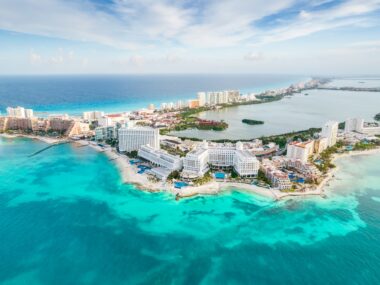 Image of Cancun, Mexico, aerial view of buildings by waters edge