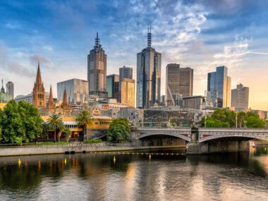 Image of the city of Melbourne across the Yarra river at sunset